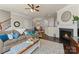 Bright living room with fireplace, hardwood floors, and ample natural light at 2430 Kensington Station Pkwy, Charlotte, NC 28210