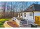 Landscaped backyard with a deck and patio area at 2740 Hill Top Dr, Salisbury, NC 28147