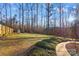 Landscaped backyard with a walkway at 2740 Hill Top Dr, Salisbury, NC 28147