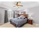 Main bedroom with king bed, ceiling fan, and large window at 2740 Hill Top Dr, Salisbury, NC 28147