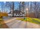 White house with a gray roof, brick skirt, and a large yard at 2740 Hill Top Dr, Salisbury, NC 28147