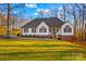 White house with brick accents, large yard, and mature trees at 2740 Hill Top Dr, Salisbury, NC 28147