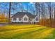 House with a large green yard and trees in the background at 2740 Hill Top Dr, Salisbury, NC 28147