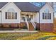 Brick and white house with a covered porch and a brick staircase at 2740 Hill Top Dr, Salisbury, NC 28147