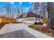 White garage with a basketball hoop and a driveway at 2740 Hill Top Dr, Salisbury, NC 28147