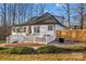 White house with deck, surrounded by trees at 2740 Hill Top Dr, Salisbury, NC 28147