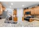 Well-equipped kitchen featuring granite countertops and wooden cabinetry at 2740 Hill Top Dr, Salisbury, NC 28147