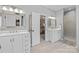 Double vanity bathroom with a walk-in shower and access to the bedroom at 3065 River Bend Dr, Tega Cay, SC 29708