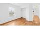 Empty room features hardwood flooring, a window providing natural light, and a closet at 3304 Caernarvon Ct, Fort Mill, SC 29715