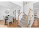 Open dining room with chandelier next to staircase and hardwood floors at 3304 Caernarvon Ct, Fort Mill, SC 29715