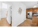 Open hallway leads to kitchen, featuring stainless steel fridge at 3304 Caernarvon Ct, Fort Mill, SC 29715