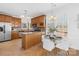 Bright kitchen with stainless appliances, breakfast bar, and adjacent dining area at 3304 Caernarvon Ct, Fort Mill, SC 29715