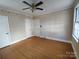 Bedroom with hardwood floors and striped wallpaper at 352 7Th Nw St, Hickory, NC 28601