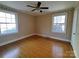 Bedroom with hardwood floors and striped wallpaper at 352 7Th Nw St, Hickory, NC 28601