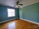 Bright bedroom with hardwood floors and teal walls at 352 7Th Nw St, Hickory, NC 28601