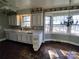 Kitchen with white cabinets, checkered wallpaper and bay window at 352 7Th Nw St, Hickory, NC 28601