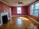 Living room with hardwood floors, fireplace and window at 352 7Th Nw St, Hickory, NC 28601