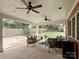 Relaxing covered patio with seating area, overlooking a fenced backyard at 3624 Trent St, Charlotte, NC 28209