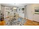 Bright dining room with hardwood floors and charming window treatments at 3624 Trent St, Charlotte, NC 28209