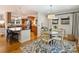 Kitchen and dining area with wood floors and rug at 3624 Trent St, Charlotte, NC 28209