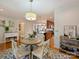 Dining room with bar cart and view to kitchen at 3624 Trent St, Charlotte, NC 28209