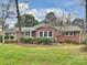 Brick ranch home with carport and landscaped lawn at 3624 Trent St, Charlotte, NC 28209