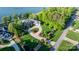 Aerial view of a property with landscaped front yard, circular driveway, and lake access at 4165 54Th Ne Ave, Hickory, NC 28601
