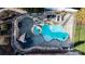 Aerial view of a landscaped backyard pool with hot tub, covered seating, outdoor grill and lounge chairs at 4165 54Th Ne Ave, Hickory, NC 28601