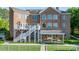 Expansive backyard with multi-level deck, covered patio, and lush green lawn at 4165 54Th Ne Ave, Hickory, NC 28601