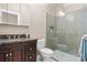 Bathroom with dark wood vanity, granite countertop, and shower at 4165 54Th Ne Ave, Hickory, NC 28601