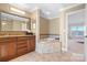 Luxurious bathroom with a soaking tub, granite countertops, and water view at 4165 54Th Ne Ave, Hickory, NC 28601