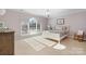 Bright bedroom with pastel colors and natural light streaming through a large window at 4165 54Th Ne Ave, Hickory, NC 28601