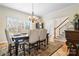 Dining room with hardwood floors, large windows, and elegant chandelier at 4165 54Th Ne Ave, Hickory, NC 28601
