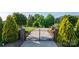 Long driveway leading to a beautiful home, framed by manicured landscaping and mature trees at 4165 54Th Ne Ave, Hickory, NC 28601