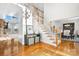 Bright foyer with hardwood floors, a staircase with white railings, and a view into the lake at 4165 54Th Ne Ave, Hickory, NC 28601
