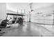 Spacious garage with epoxy flooring, multiple garage doors, and a golf cart at 4165 54Th Ne Ave, Hickory, NC 28601