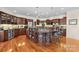 Gourmet kitchen featuring custom cabinetry, a large island with seating, and stainless steel appliances at 4165 54Th Ne Ave, Hickory, NC 28601
