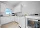 Bright laundry room featuring white cabinets and modern appliances at 4165 54Th Ne Ave, Hickory, NC 28601