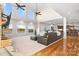 Spacious living room with high ceilings, large windows with a lake view, and a brick fireplace at 4165 54Th Ne Ave, Hickory, NC 28601