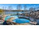 Relaxing lakefront pool and hot tub with stonework at 4165 54Th Ne Ave, Hickory, NC 28601