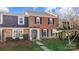 Brick front townhouse with a charming, landscaped yard at 4413 Simsbury Rd, Charlotte, NC 28226