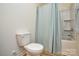 Bathroom with bathtub, toilet, and shower at 4418 Huntley Glen Dr, Pineville, NC 28134