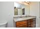 Double vanity bathroom with granite countertop and large mirror at 4418 Huntley Glen Dr, Pineville, NC 28134