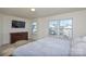 Main bedroom with king bed and dresser at 4418 Huntley Glen Dr, Pineville, NC 28134