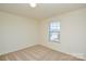 Spacious bedroom with window and carpet at 4418 Huntley Glen Dr, Pineville, NC 28134