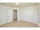 Well-lit bedroom with double doors and carpet at 4418 Huntley Glen Dr, Pineville, NC 28134