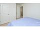 Bright bedroom with double doors and carpet at 4418 Huntley Glen Dr, Pineville, NC 28134