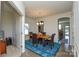 Dining room with rustic wood table and blue area rug at 4418 Huntley Glen Dr, Pineville, NC 28134