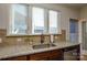 Kitchen with granite countertops and stainless steel sink at 4418 Huntley Glen Dr, Pineville, NC 28134