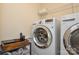 Laundry room with washer, dryer, and shelving at 4418 Huntley Glen Dr, Pineville, NC 28134